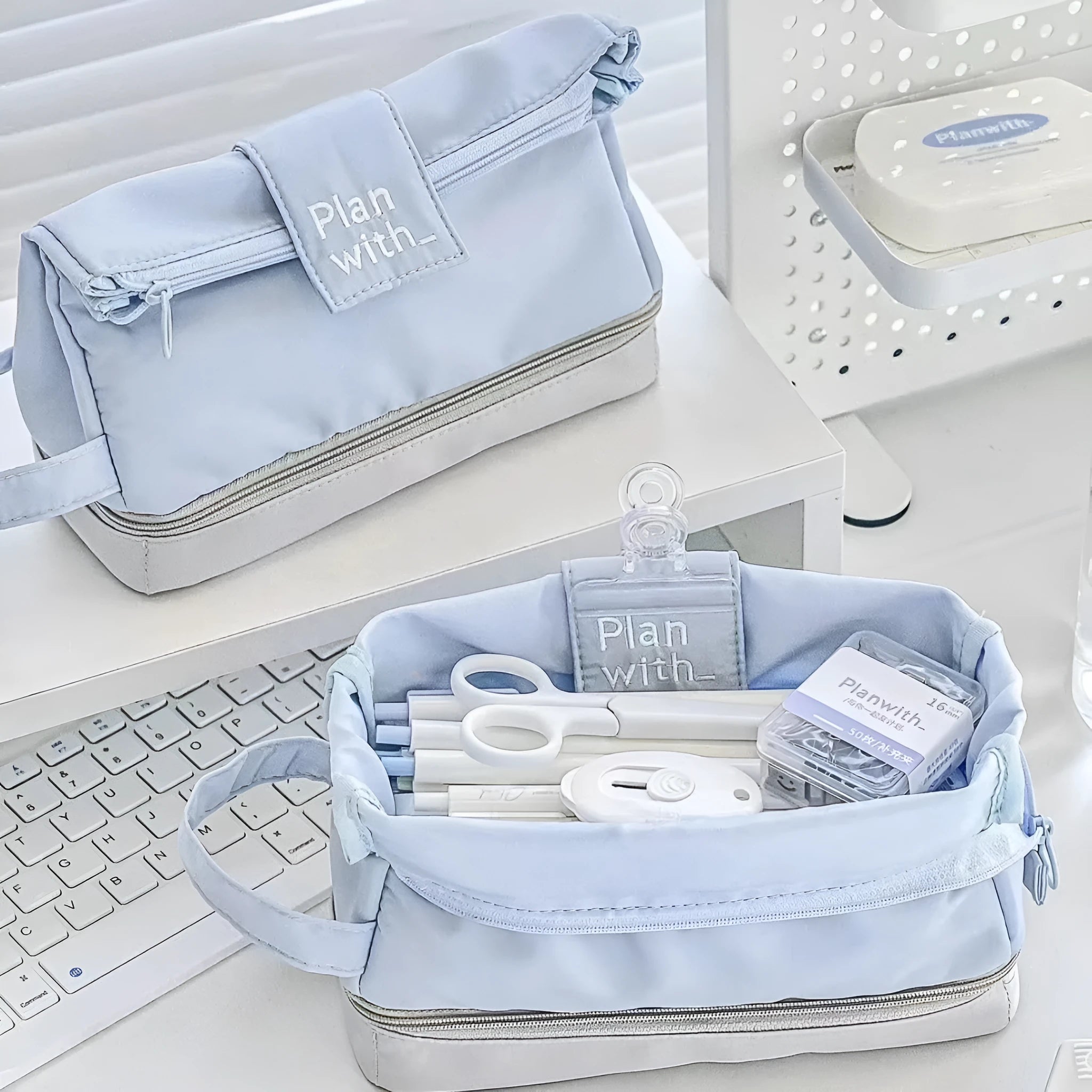 Polyester folding double-layer pencil case in dark blue, blue, and cream white colours.