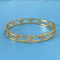 Women's hollow bracelet with zircon four-leaf clover design in gold or silver
