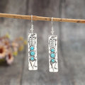 Women's silver geometric retro earrings with inlaid turquoise detailing on long strip design