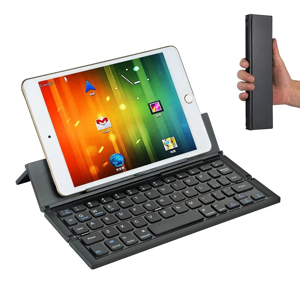 Black and white views of a folded mini wireless Bluetooth keyboard for tablets next to a smartphone.
