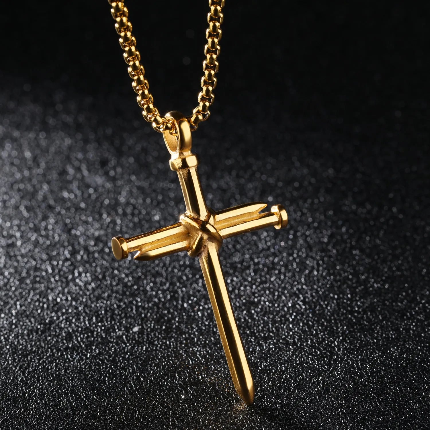 Titanium steel cross nail pendant necklace for men in silver finish on display