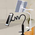 Black flexible tablet holder with suction cup base bent to hold a phone at an angle.