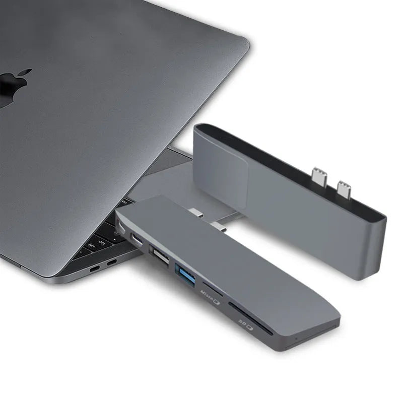 8-in-1 USB-C expansion hub for MacBook Pro with dual plugs, USB ports, card readers, and SSD slot