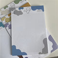 INS Wind Marshmallow Dog B5 sticky note paper sheets showing puppy designs in purple, blue, green, orange, and grey.