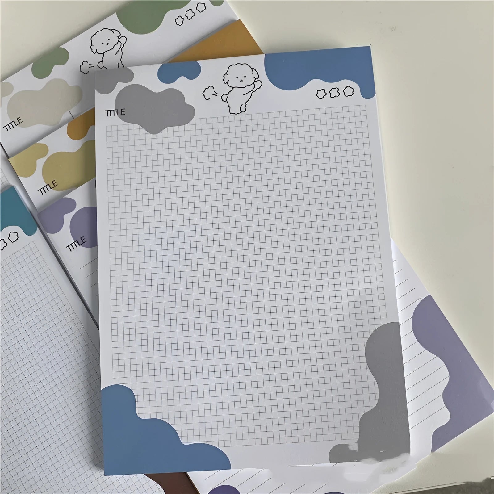 INS Wind Marshmallow Dog B5 sticky note paper sheets showing puppy designs in purple, blue, green, orange, and grey.