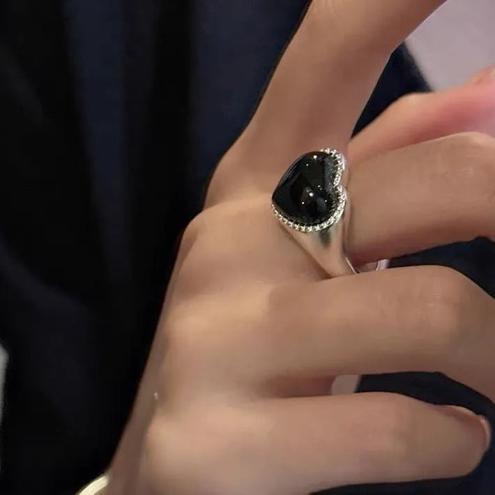 S925 sterling silver adjustable ring with black agate heart stone on finger