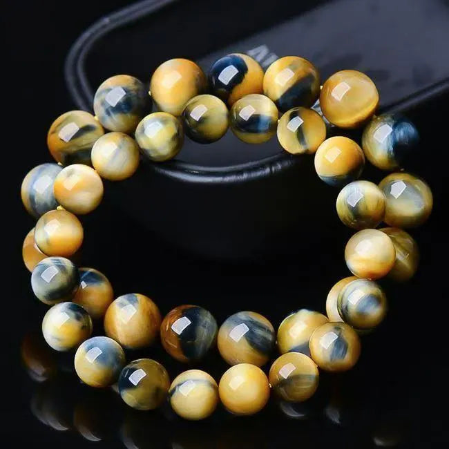 Natural agate fantasy tigereye round bead bracelet on white background, unisex handmade single-circle style