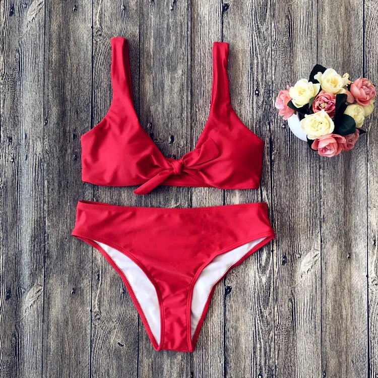 Solid colour polyester bikini swimsuit set on a white background