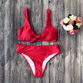 Solid colour polyester bikini swimsuit set on a white background