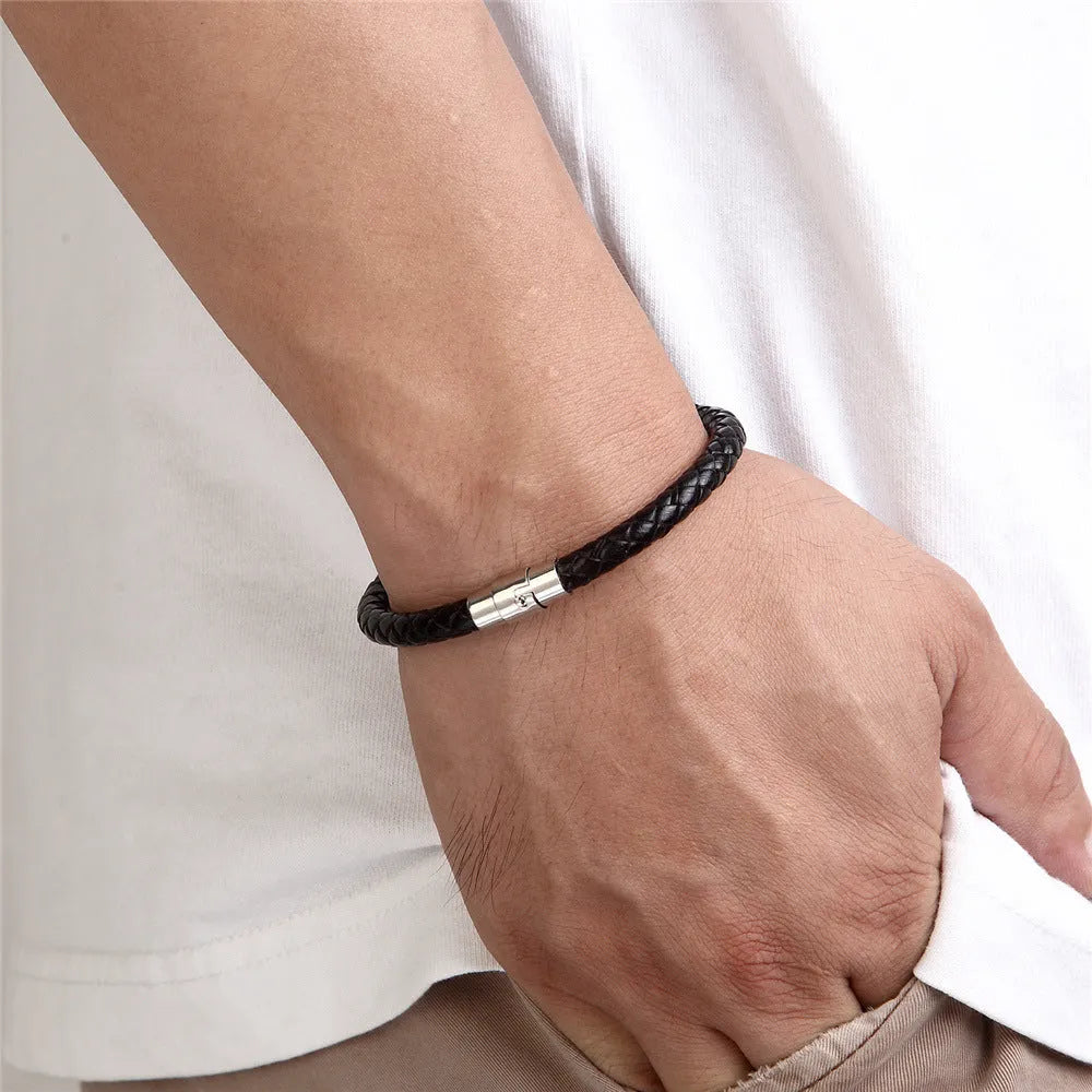 Titanium steel geometric wire bracelet with magnet socket closure in silver tone.