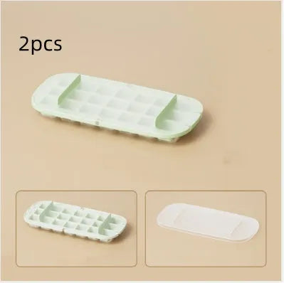 Yellow and blue flexible plastic ice cube trays with grid pattern and a stored ice shovel