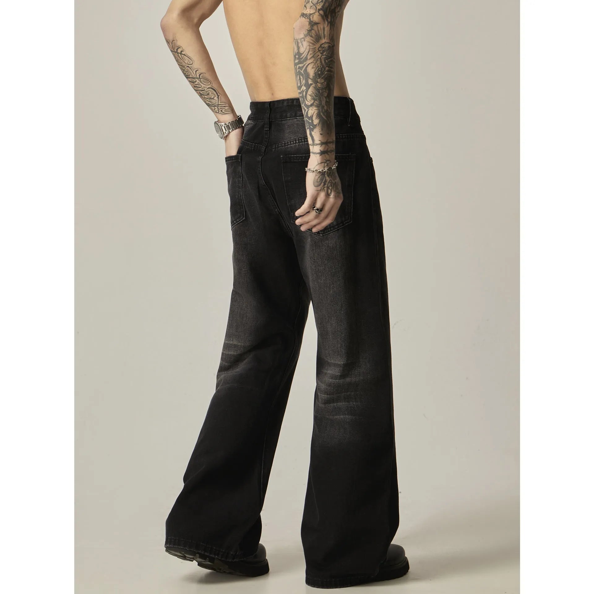 Black straight-leg jeans with American retro styling and zipper fly