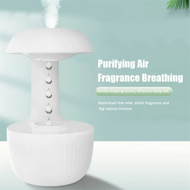 White anti-gravity air humidifier with ultrasonic mist levitating water drops on a desk