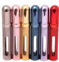 12ml aluminium portable perfume bottle atomiser in six colour options shown next to a ruler for scale.