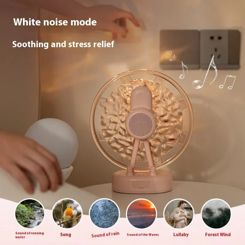 Ferris wheel water ripple Bluetooth speaker with colourful atmosphere light in pink on a white background