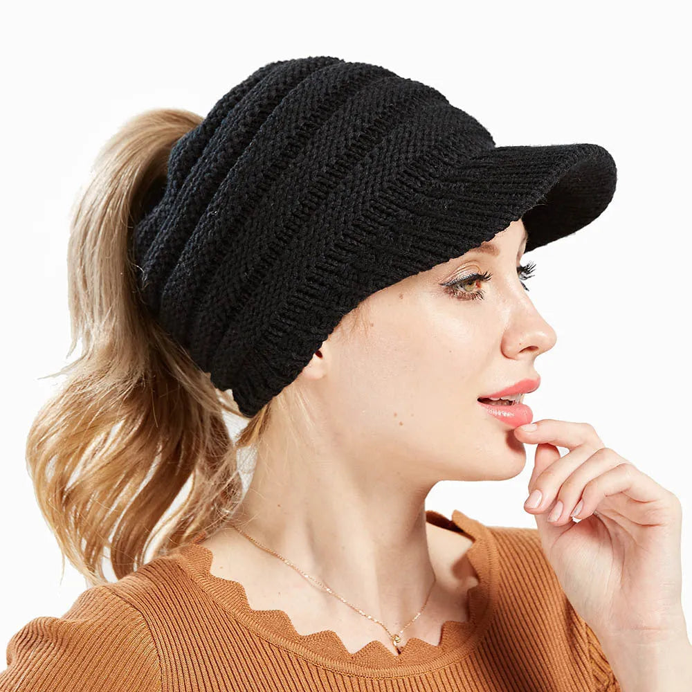 Women's thick knit ponytail beanie in acrylic yarn showing hairstyle accommodation