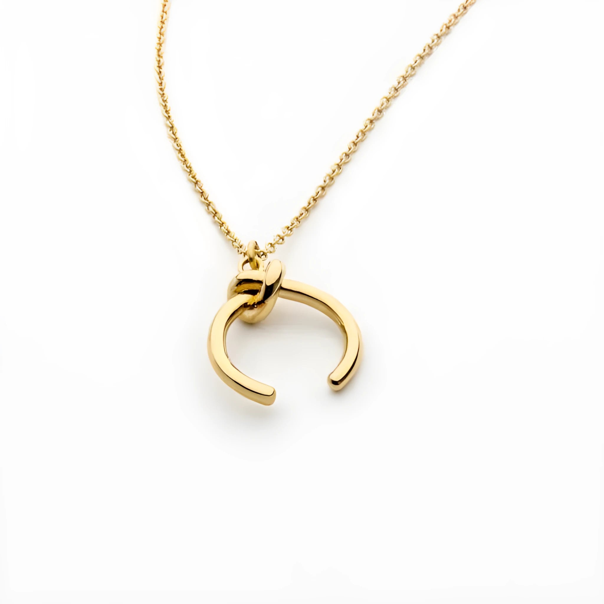 Vintage-style copper pendant necklace with geometric shape on cross chain in gold or silver finish