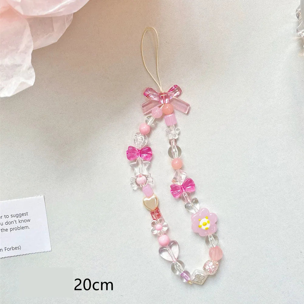 Plastic beaded mobile phone lanyard with floral charms in blue, pink or yellow colour options