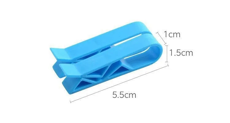 PP plastic bin bag fixing clip attached to a rubbish bin rim holding a liner in place.