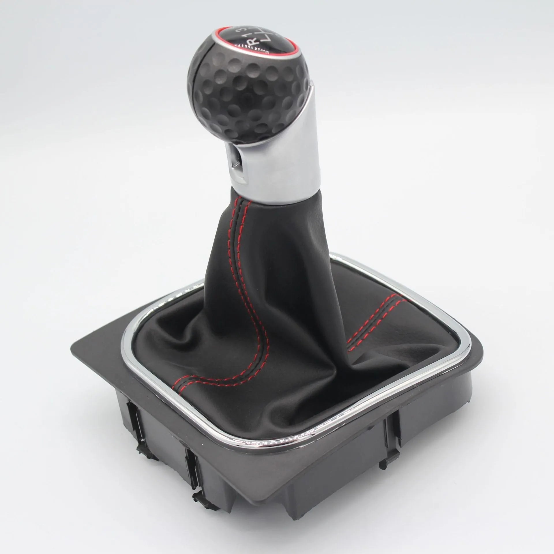 Leather gear shift knob with black dust boot for Volkswagen Golf manual transmission.