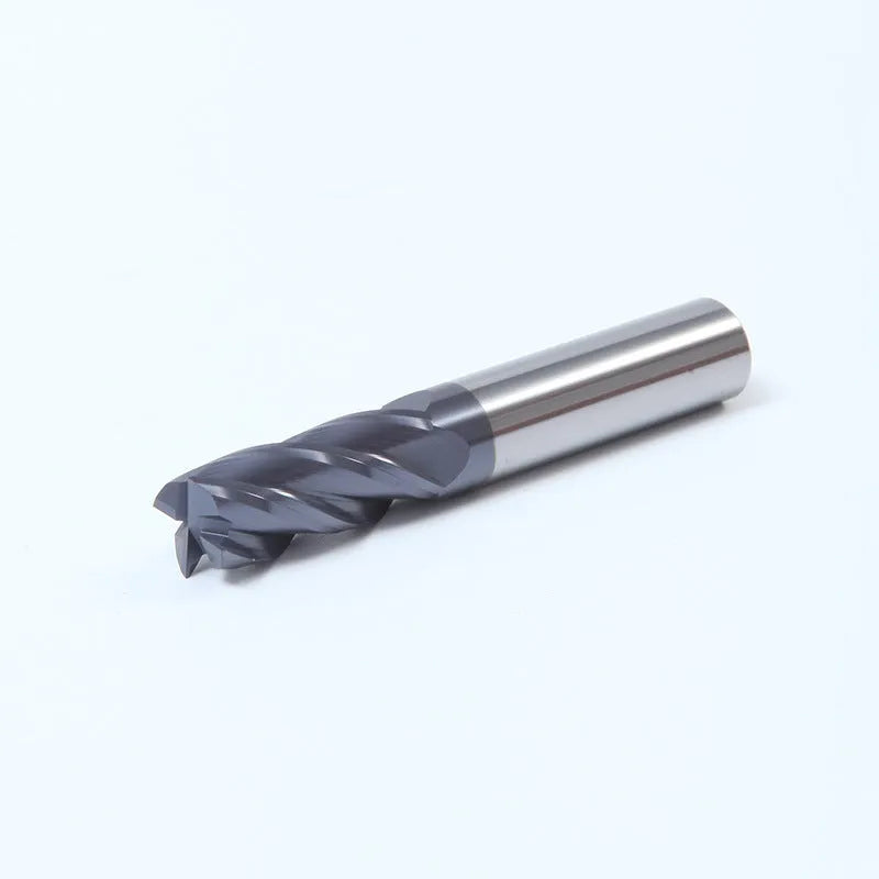 Carbide four-flute spiral milling cutter with straight shank on a white background.