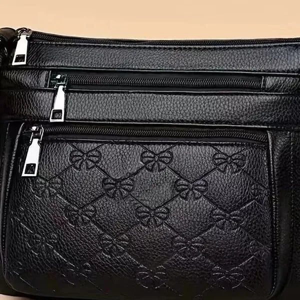 Women's butterfly black PU leather messenger bag with adjustable strap and phone pocket