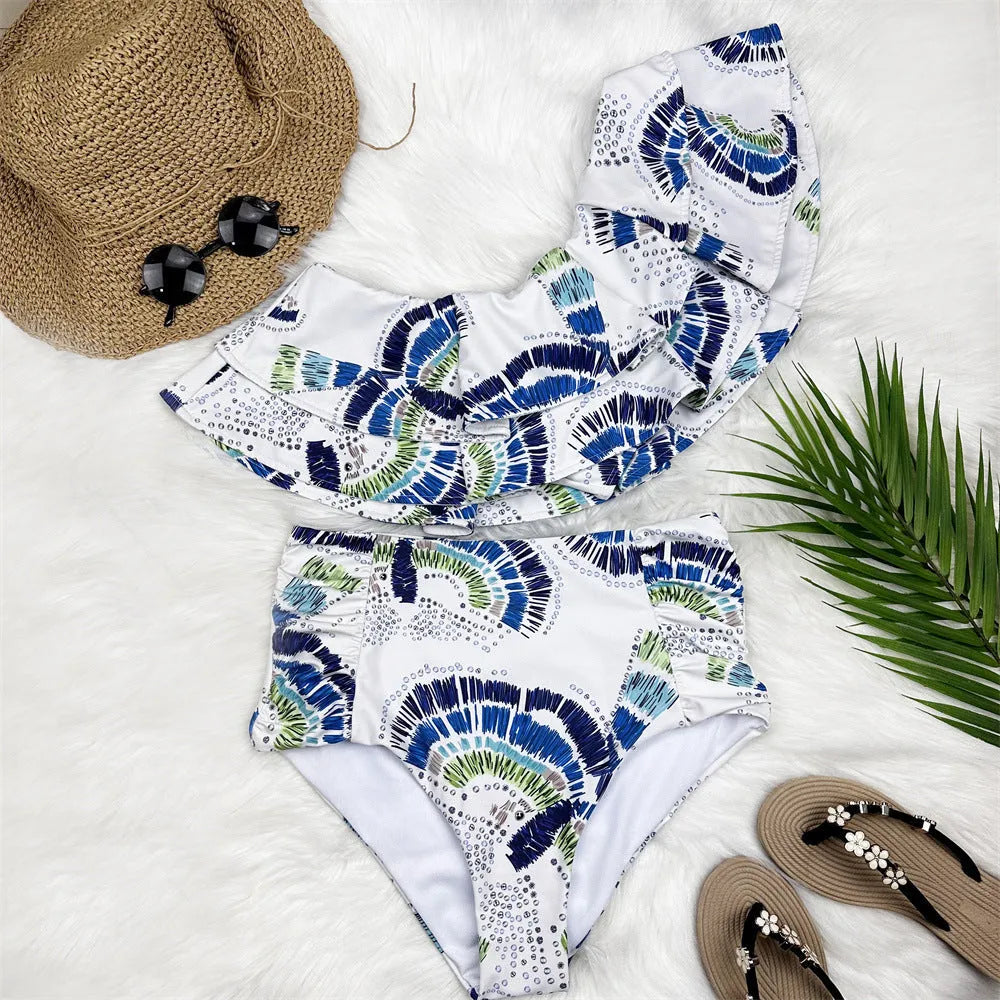 White women's one-shoulder swimsuit with lotus leaf design and thigh split