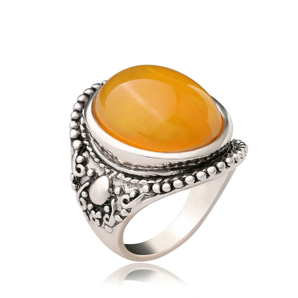 Retro geometric alloy ring with antique silver amber electroplating showing fluorescent beeswax elements