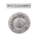 Fluffy donut-shaped dog bed with raised edges in luxury long plush fabric
