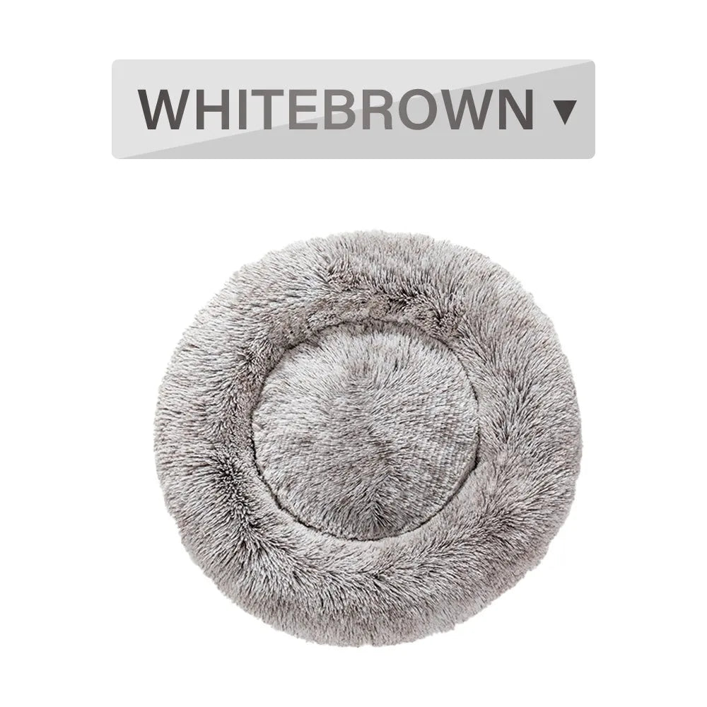 Fluffy donut-shaped dog bed with raised edges in luxury long plush fabric