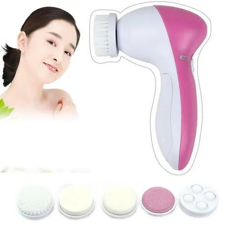 Pink electric facial cleanser with soft brush attachment and roller massager on white background, compact size