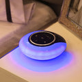 Blue Bluetooth desk lamp with speaker, shown folded, with touch controls on a white base.