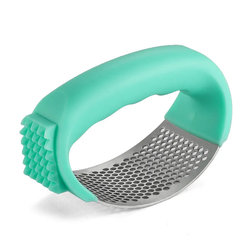 304 stainless steel garlic press 11x7cm in modern simple design on a kitchen counter