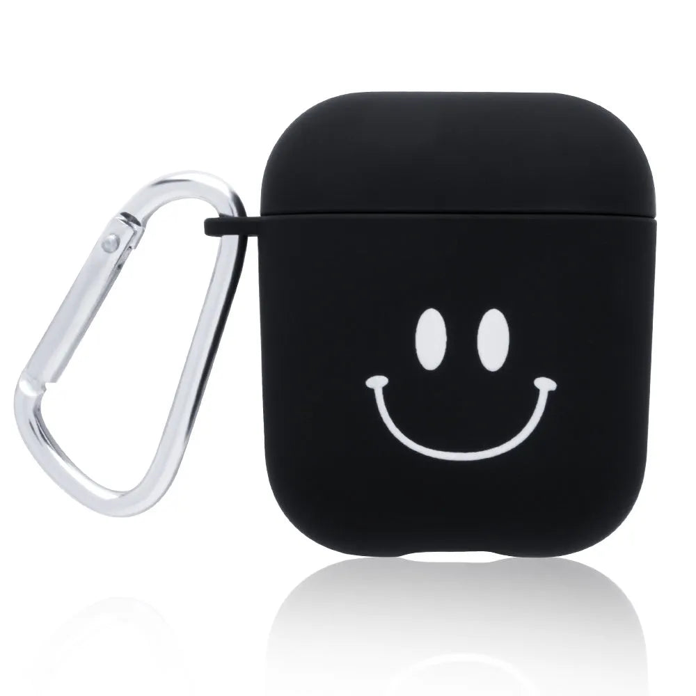 Black and pink AirPods case covers with smiley face and flower decorative motifs