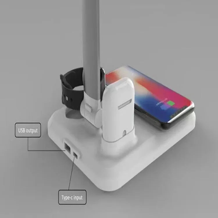 Black and white 4-in-1 LED desk lamp with wireless charging pad showing USB-C port