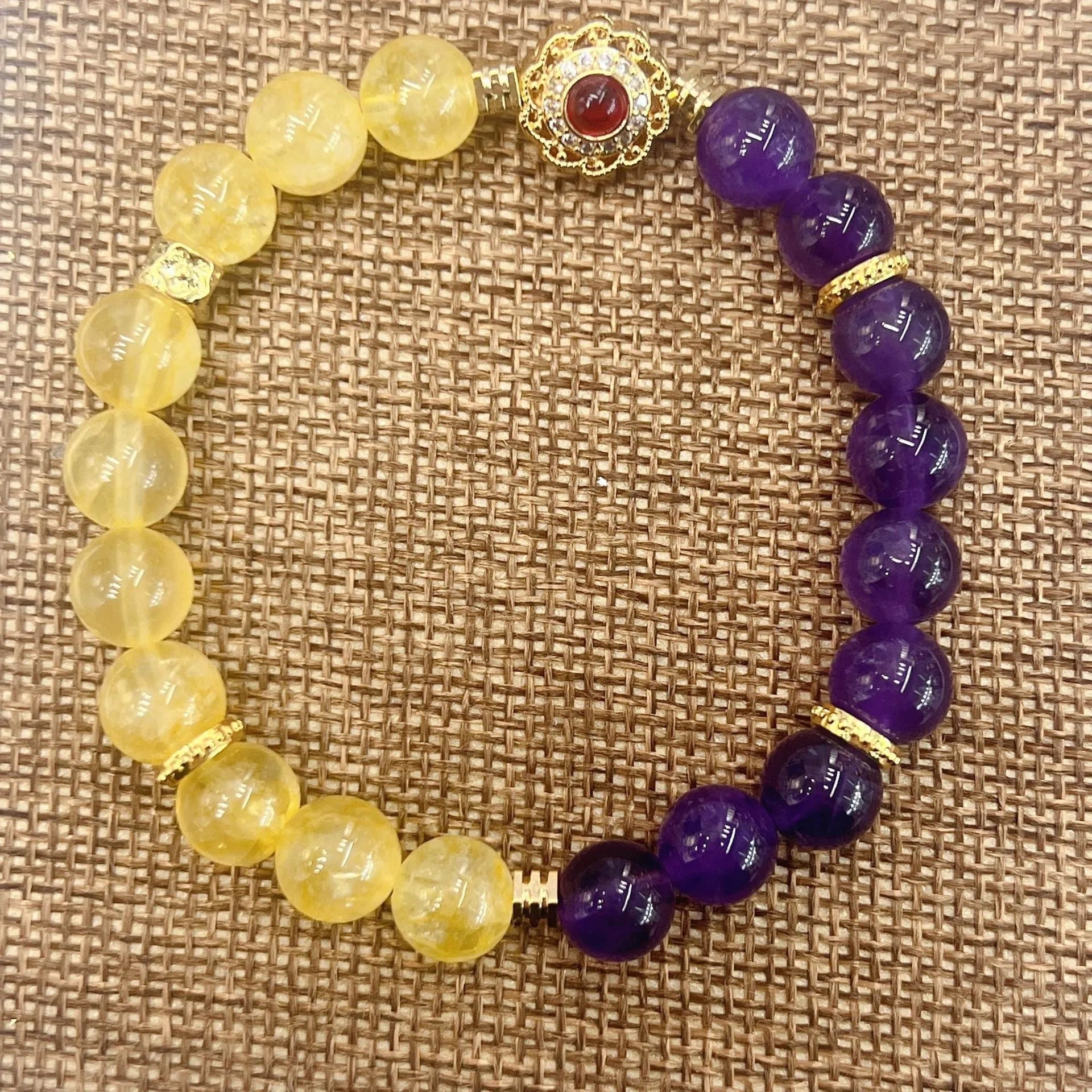 Handmade women's amethyst crystal bracelet with yellow and purple colour tones