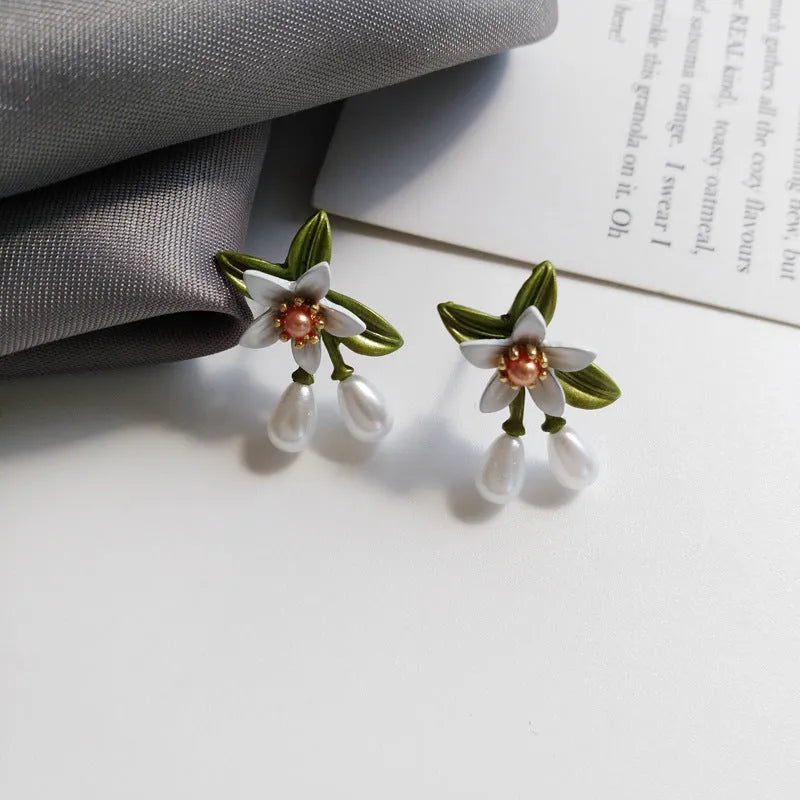 Women's camellia flower earrings in alloy with floral design and two colour options