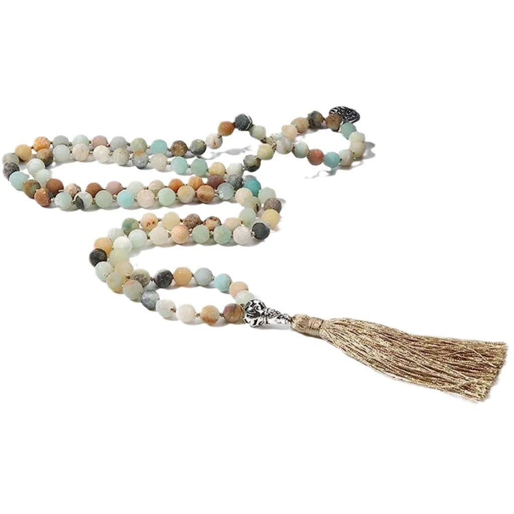 Handmade knotted beaded necklace with 108 natural stone beads in a simple geometric style on a white background