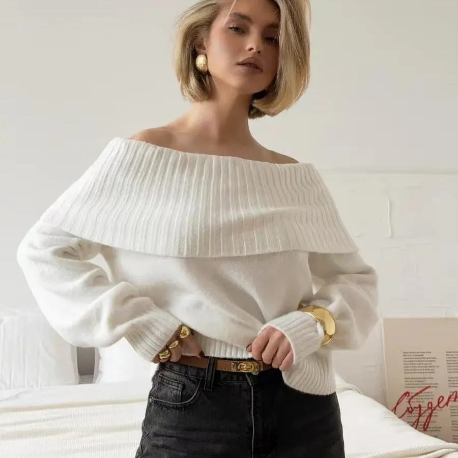 Grey off-the-shoulder strapless sweater with a 3D pattern, shown as a pullover.
