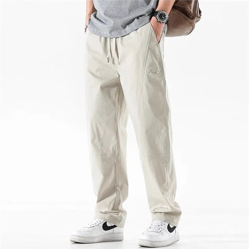Milky white wide-leg antibacterial cotton trousers shown flat lay