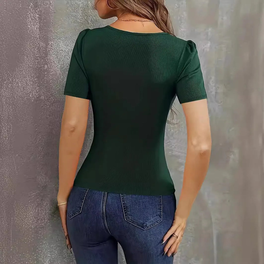 Women's wine red slim fit knitted short sleeve top with low neckline on a hanger.
