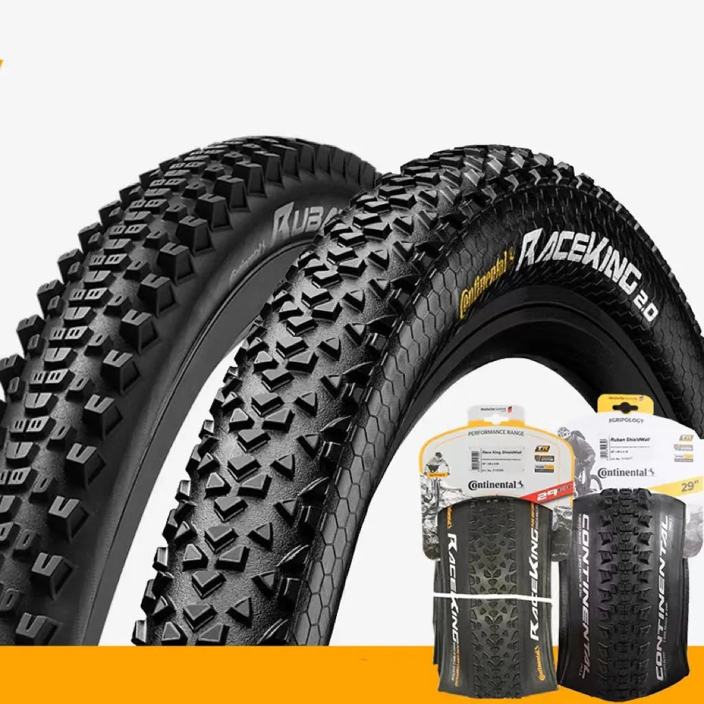 Mountain bike outer tyre showing yellow sidewall, labelled with sizes 26, 27.5, 29 inches and 2.0, 2.2 width options.