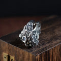 Silver open style ring with detailed jibeast animal pattern and diamond accents