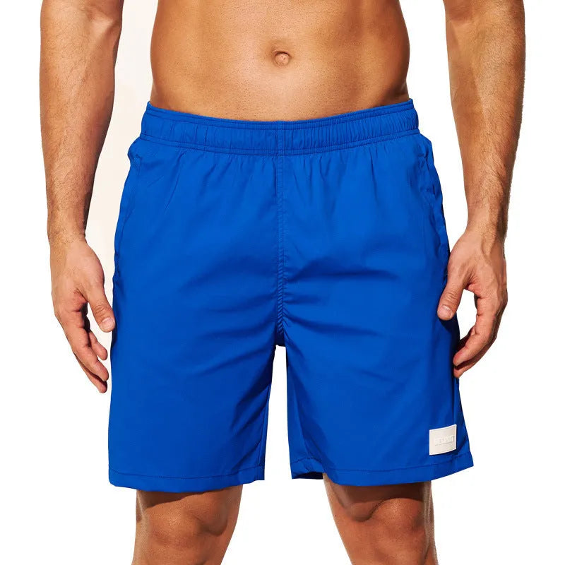 Men's quick-drying nylon beach shorts in blue with straight leg openings.