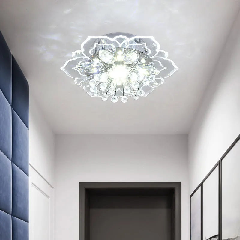 Modern crystal ceiling lamp with flower-shaped acrylic and crystal shade showing LED lighting