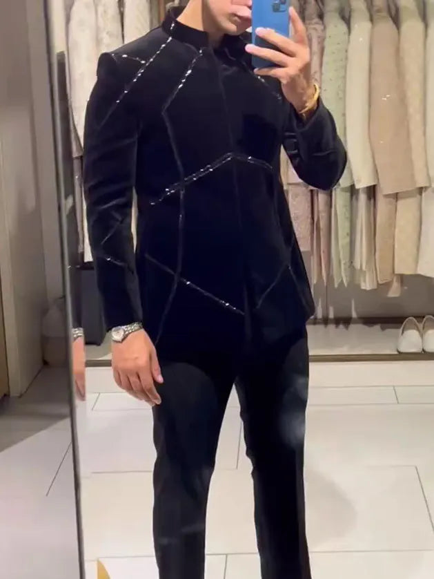 Black structured jacket with contrast geometric patchwork accents, regular fit, front view