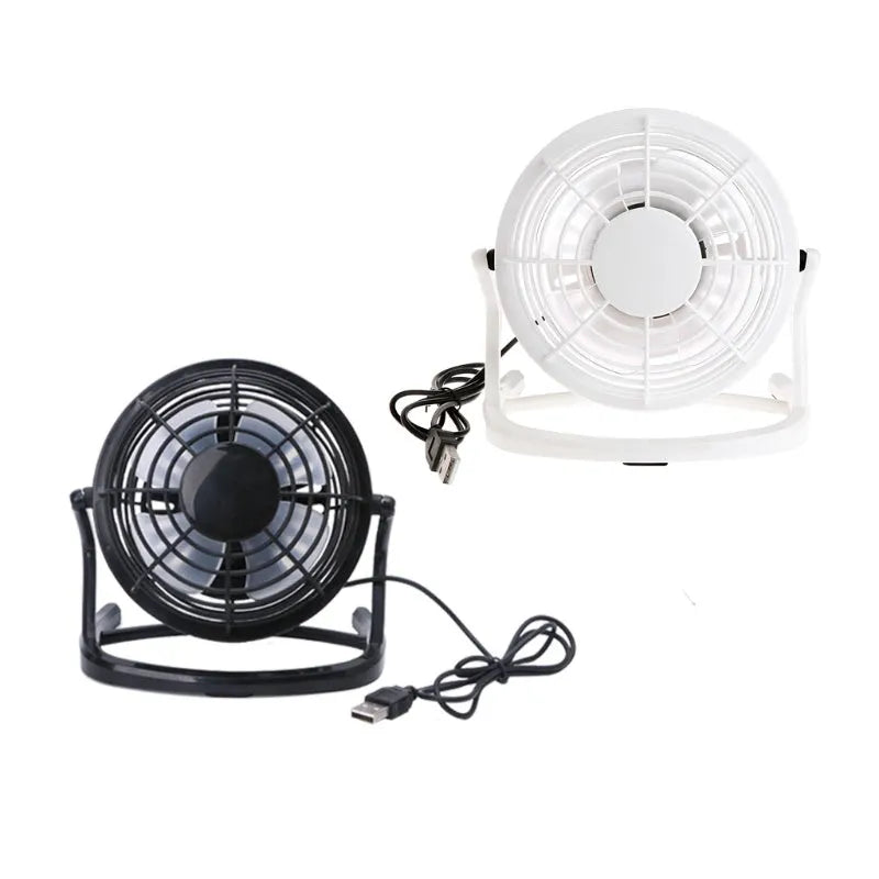 Mini black USB desk fan with adjustable angle for laptop cooling on wooden desk