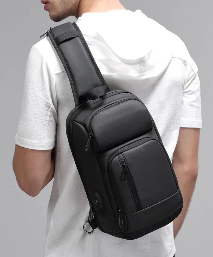 Black medium capacity outdoor shoulder bag with air cushion strap and multiple compartments