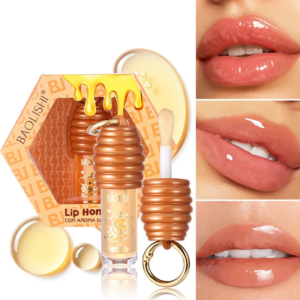 Honey Lip Gloss with keychain attached, showing portable design for bags and paniers