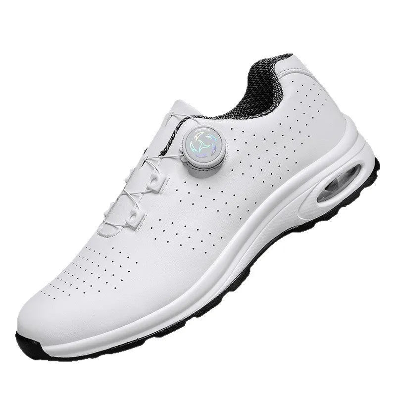 Black and white low top mesh tennis shoes with a round toe and flat composite sole on a plain background.